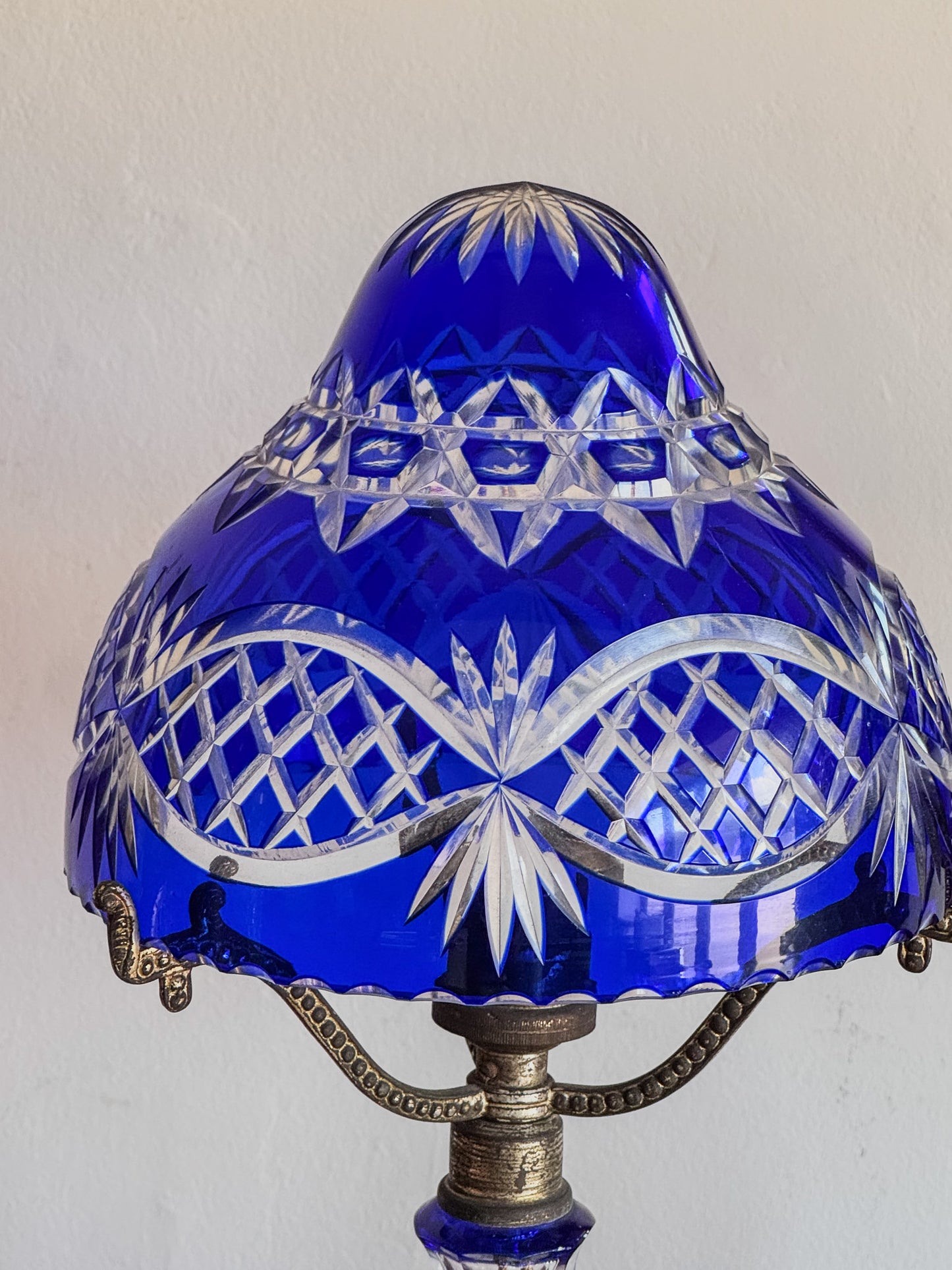 A Pair of Edwardian Bohemian Blue Cut Glass Lamps