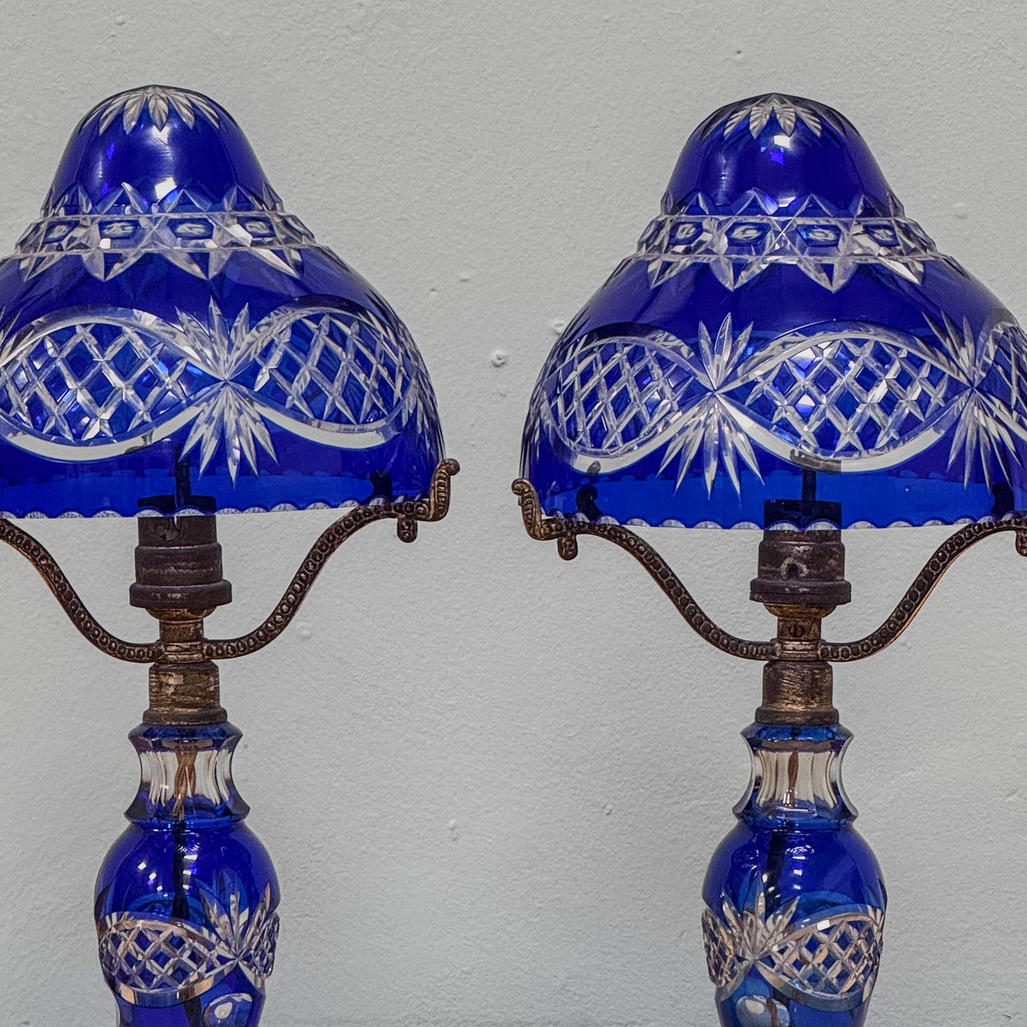 A Pair of Edwardian Bohemian Blue Cut Glass Lamps