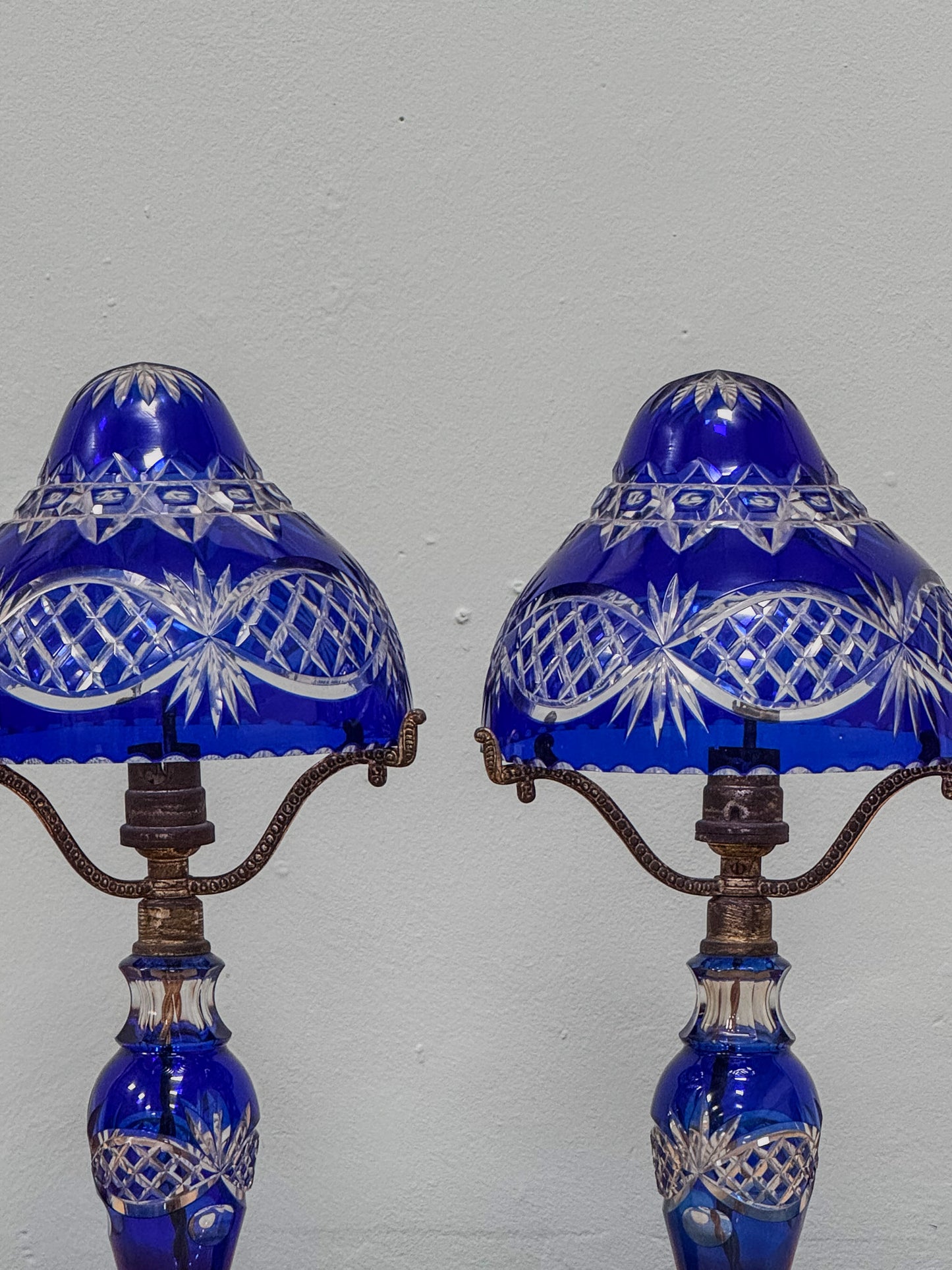 A Pair of Edwardian Bohemian Blue Cut Glass Lamps